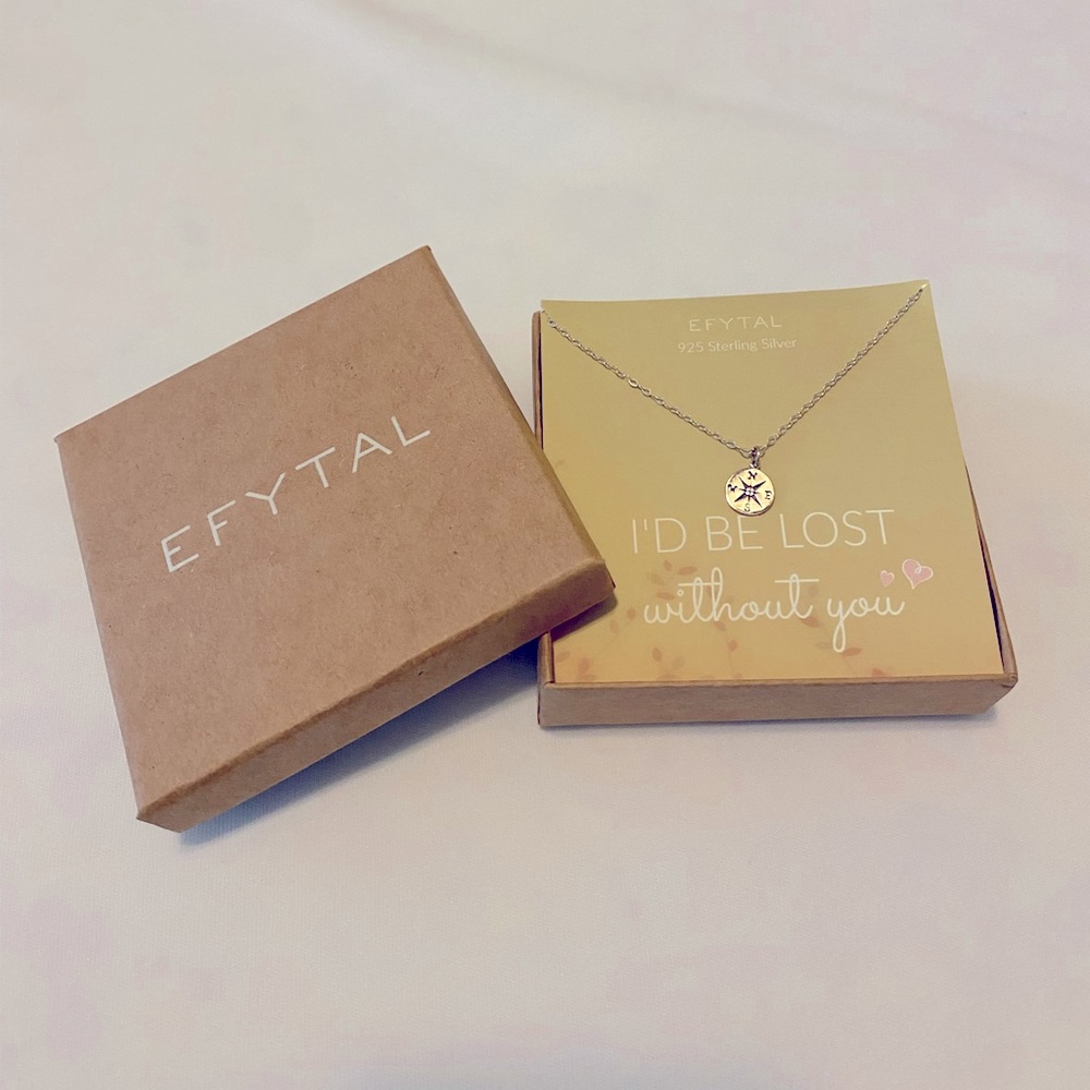 Efytal sterling silver compass necklace.